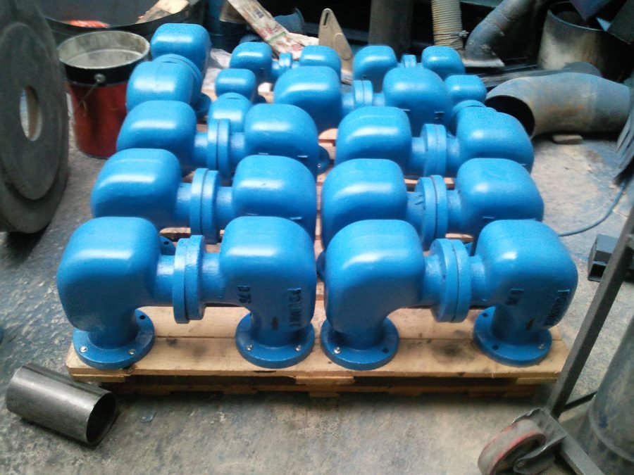 Batch of blue Polimak compact flanged conveying elbows